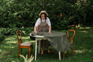 Olive green round linen tablecloth with ruffles