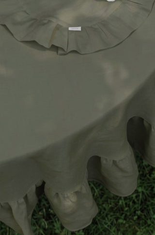 Olive green round linen tablecloth with ruffles