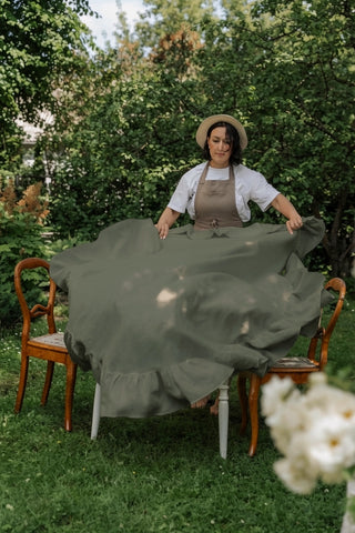 Olive green round linen tablecloth with ruffles